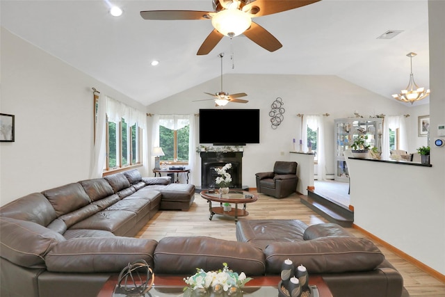 35 Lattintown Rd, Newburgh, NY 12550 - living room featuring light wood-style flooring, a ceiling fan, lofted ceiling, a high end fireplace, and recessed lighting