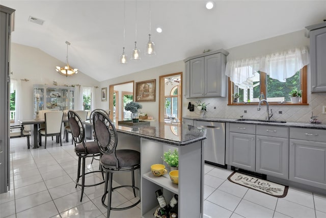 35 Lattintown Rd, Newburgh, NY 12550 - kitchen featuring stainless steel dishwasher, gray cabinets, vaulted ceiling, open shelves, and decorative backsplash