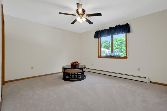 35 Lattintown Rd, Newburgh, NY 12550 - carpeted empty room featuring a baseboard heating unit and a ceiling fan