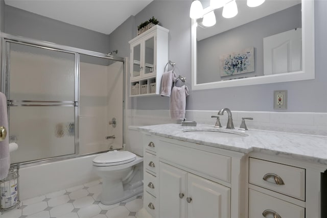 35 Lattintown Rd, Newburgh, NY 12550 - bathroom featuring vanity and bath / shower combo with glass door