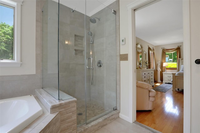 35 Lattintown Rd, Newburgh, NY 12550 - full bath featuring a garden tub, a shower stall, ensuite bath, and wood finished floors