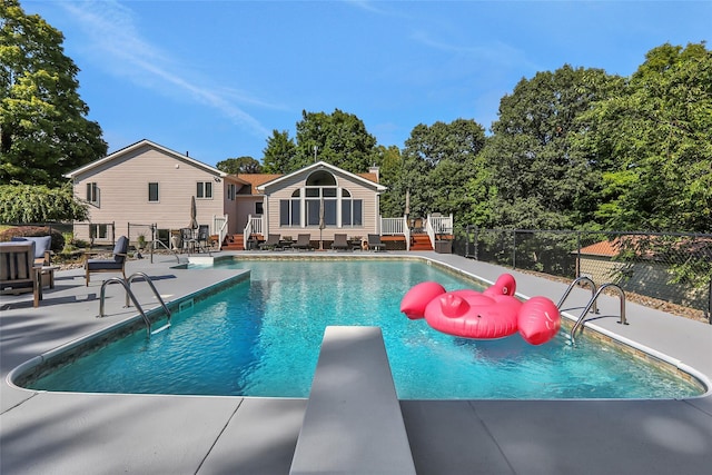35 Lattintown Rd, Newburgh, NY 12550 - view of swimming pool featuring a patio, a diving board, and a wooden deck