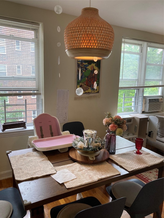105-24 67th Ave Unit 4A, Forest Hills, NY 11375 - dining area with cooling unit and wood finished floors