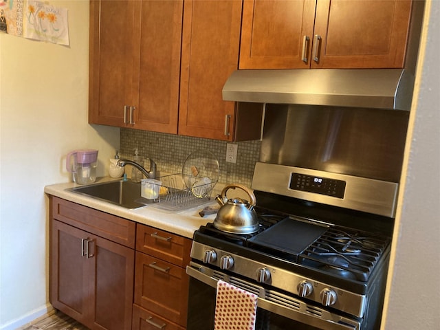 105-24 67th Ave Unit 4A, Forest Hills, NY 11375 - kitchen with stainless steel gas range, wall chimney range hood, tasteful backsplash, and light countertops