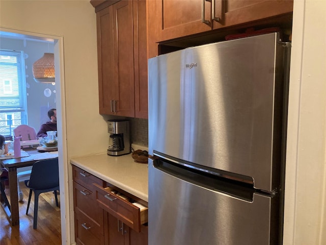 105-24 67th Ave Unit 4A, Forest Hills, NY 11375 - kitchen with freestanding refrigerator, light countertops, wood finished floors, and brown cabinetry
