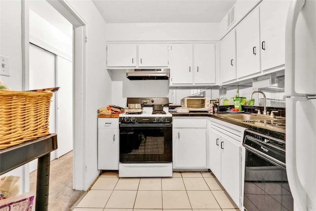 175 Archer St Unit 3A, Freeport, NY 11520 - kitchen featuring white appliances, under cabinet range hood, white cabinets, and dark countertops
