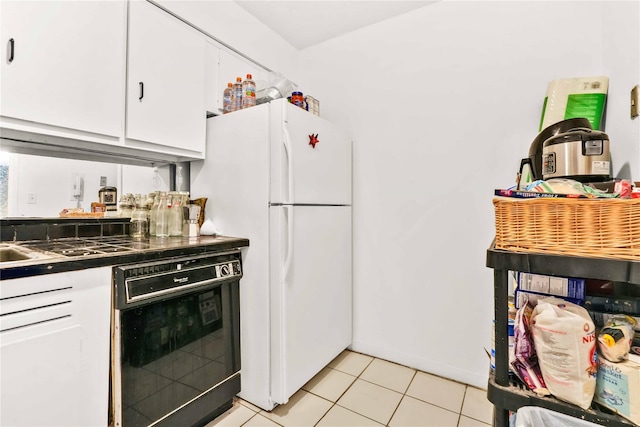 175 Archer St Unit 3A, Freeport, NY 11520 - kitchen featuring freestanding refrigerator, white cabinetry, dishwasher, light tile patterned floors, and dark countertops