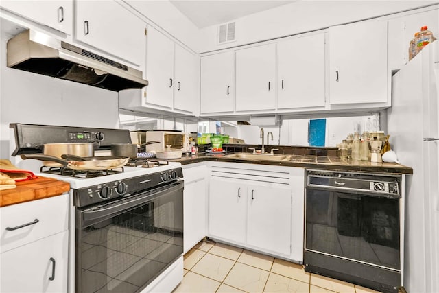 175 Archer St Unit 3A, Freeport, NY 11520 - kitchen featuring range with gas stovetop, black dishwasher, under cabinet range hood, white cabinets, and light tile patterned flooring