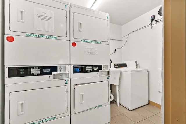 175 Archer St Unit 3A, Freeport, NY 11520 - community laundry room featuring stacked washing machine and dryer, washing machine and clothes dryer, and light tile patterned floors