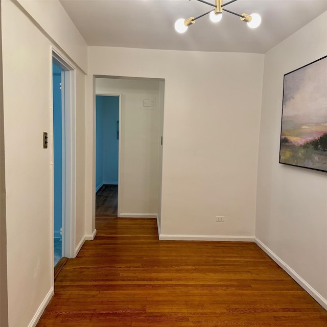 83-20 98th St Unit 1H, Woodhaven, NY 11421 - empty room with a chandelier and wood finished floors