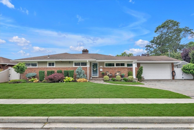 2854 Lenox Rd, Oceanside, NY 11572 - ranch-style home featuring a chimney, decorative driveway, brick siding, and an attached garage