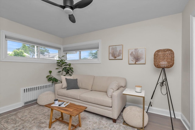 2854 Lenox Rd, Oceanside, NY 11572 - living room with radiator, wood finished floors, and ceiling fan