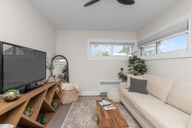 2854 Lenox Rd, Oceanside, NY 11572 - living area featuring radiator, wood finished floors, and a ceiling fan