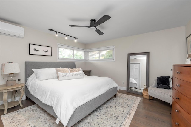 2854 Lenox Rd, Oceanside, NY 11572 - bedroom featuring a wall unit AC, wood finished floors, track lighting, and ceiling fan