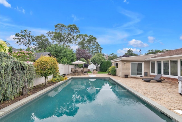 2854 Lenox Rd, Oceanside, NY 11572 - view of swimming pool featuring a patio, a fenced backyard, and outdoor dining space