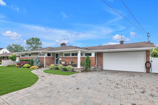 2854 Lenox Rd, Oceanside, NY 11572 - ranch-style home with a garage, brick siding, decorative driveway, and a front lawn