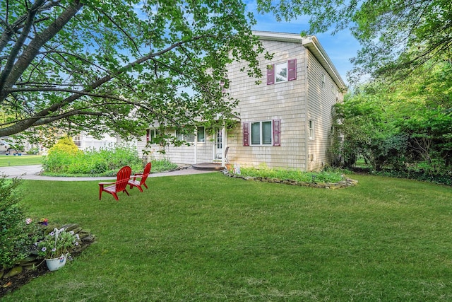 436 Oceanside St, Islip Terrace, NY 11752 - rear view of property with a lawn