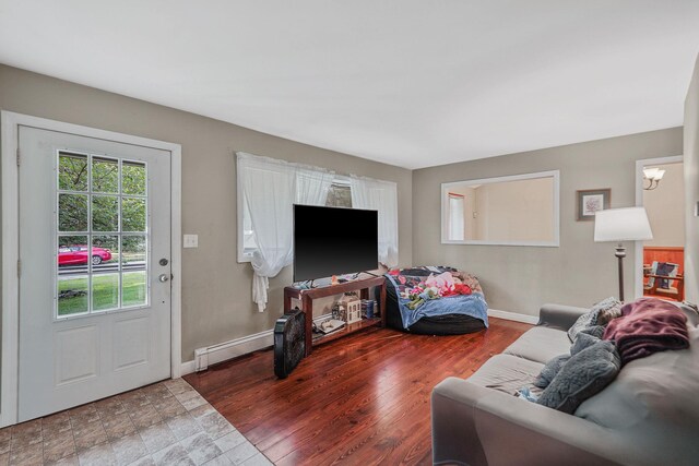 436 Oceanside St, Islip Terrace, NY 11752 - living area with a baseboard heating unit and baseboards