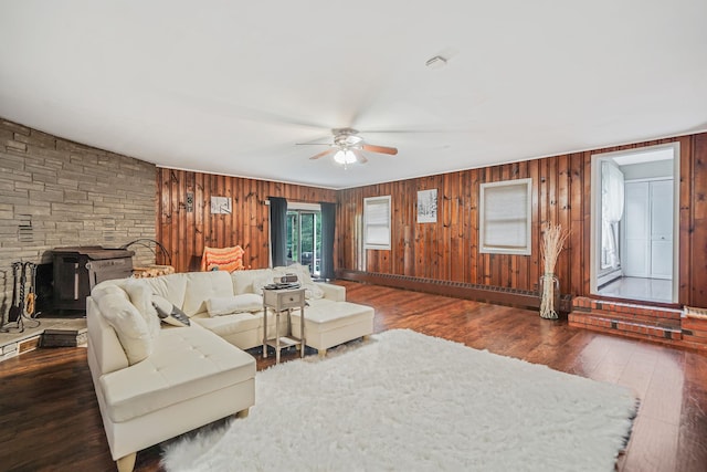 436 Oceanside St, Islip Terrace, NY 11752 - living area featuring a ceiling fan, wood-type flooring, and wood walls