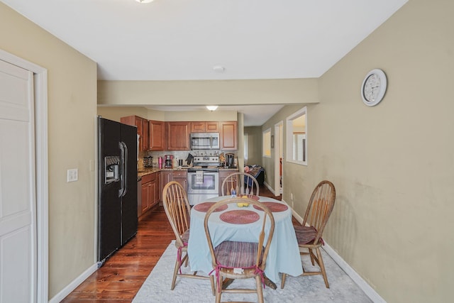 436 Oceanside St, Islip Terrace, NY 11752 - dining room featuring dark wood finished floors and baseboards