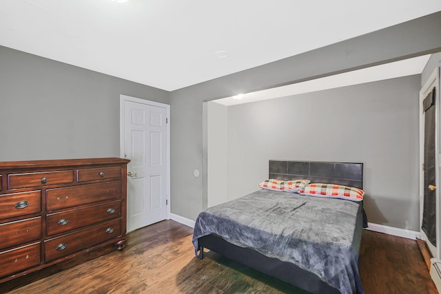 436 Oceanside St, Islip Terrace, NY 11752 - bedroom featuring dark wood finished floors and a baseboard radiator