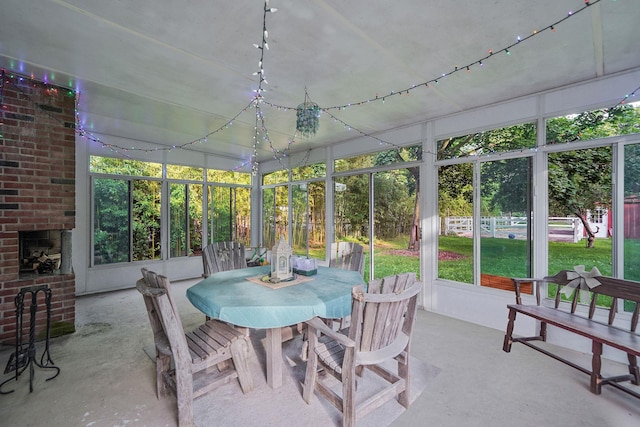 436 Oceanside St, Islip Terrace, NY 11752 - sunroom featuring outdoor dining area and a fireplace