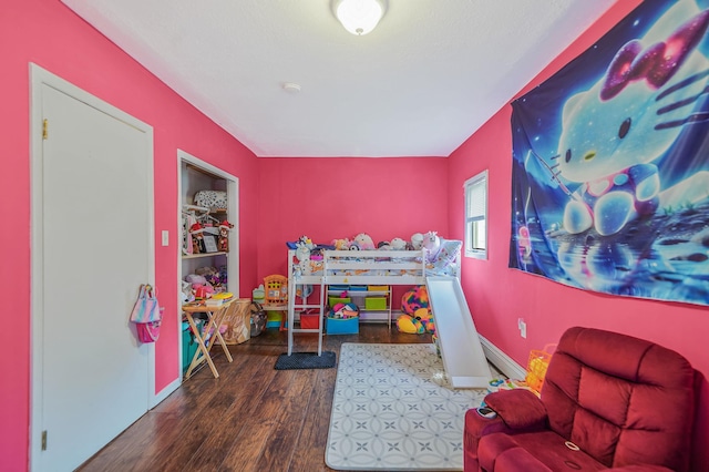 436 Oceanside St, Islip Terrace, NY 11752 - playroom featuring wood finished floors and baseboards