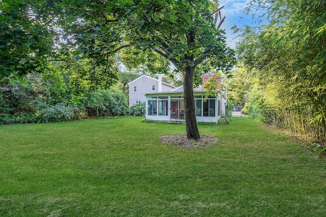 436 Oceanside St, Islip Terrace, NY 11752 - view of grassy yard with a sunroom