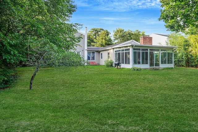 436 Oceanside St, Islip Terrace, NY 11752 - view of green lawn featuring a sunroom