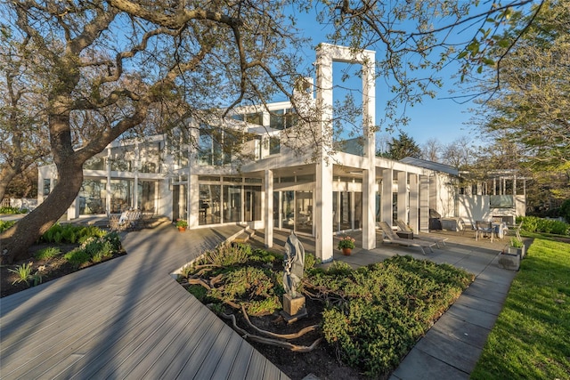 4105 Soundview Ave, Mattituck, NY 11952 - back of house featuring a patio area and a sunroom