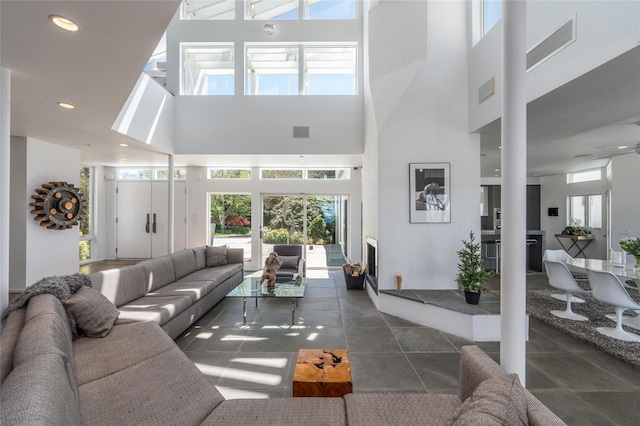 4105 Soundview Ave, Mattituck, NY 11952 - living room featuring a towering ceiling and recessed lighting