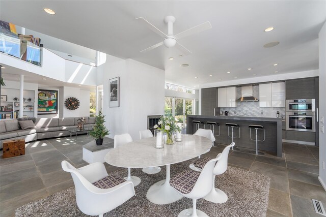 4105 Soundview Ave, Mattituck, NY 11952 - dining area featuring ceiling fan, recessed lighting, and stone tile floors