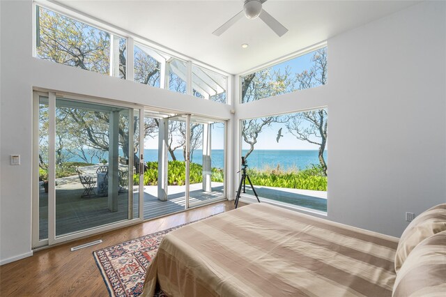 4105 Soundview Ave, Mattituck, NY 11952 - bedroom featuring a water view, access to outside, multiple windows, and a high ceiling