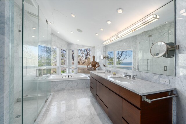 4105 Soundview Ave, Mattituck, NY 11952 - full bath featuring marble tiled flooring, lofted ceiling, a bath, double vanity, and a shower stall