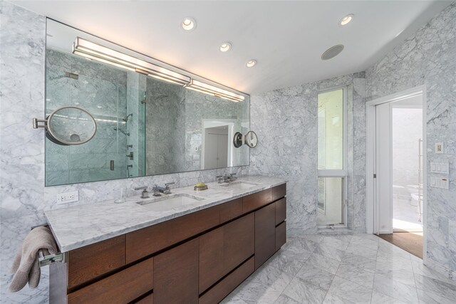 4105 Soundview Ave, Mattituck, NY 11952 - bathroom with double vanity, marble finish flooring, a shower stall, recessed lighting, and tile walls