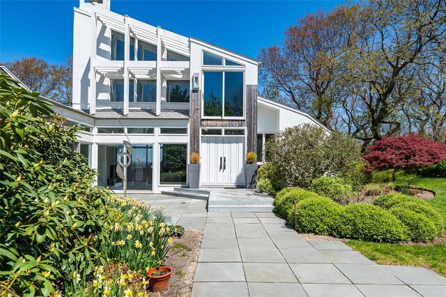 4105 Soundview Ave, Mattituck, NY 11952 - rear view of house featuring board and batten siding