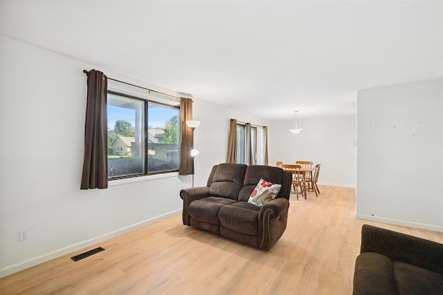 52 Jefferson Oval Unit E, Yorktown Heights, NY 10598 - living room featuring light wood-style floors and baseboards