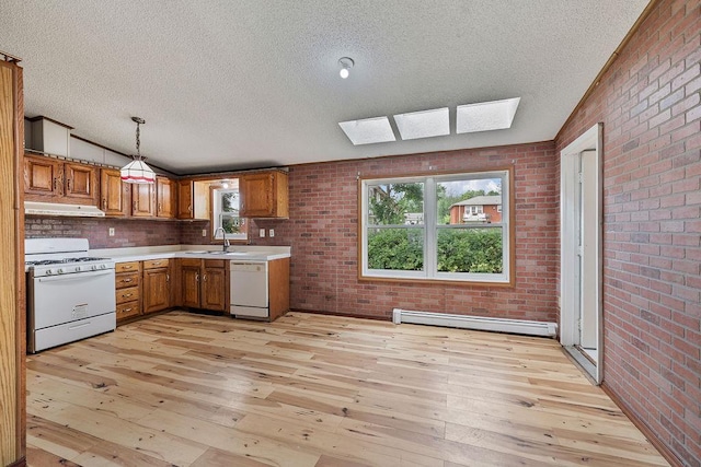 14 Cooper Dr, Nanuet, NY 10954 - kitchen featuring white appliances, a baseboard radiator, a skylight, under cabinet range hood, and a textured ceiling