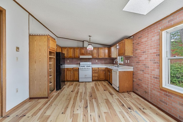 14 Cooper Dr, Nanuet, NY 10954 - kitchen with white appliances, brown cabinets, brick wall, range hood, and lofted ceiling