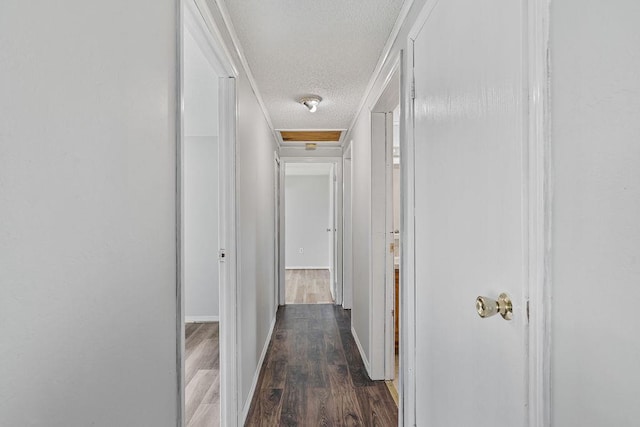 14 Cooper Dr, Nanuet, NY 10954 - hall with a textured ceiling, dark wood-type flooring, and attic access