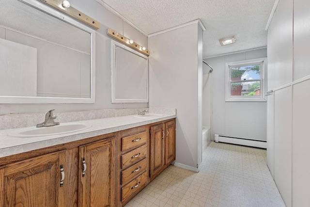 14 Cooper Dr, Nanuet, NY 10954 - bathroom featuring baseboard heating, double vanity, a textured ceiling, and shower / tub combo