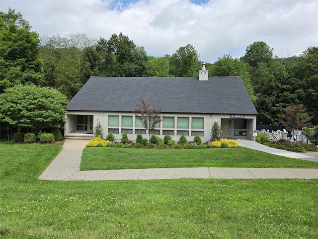 69 Mitchell Rd, Somers, NY 10589 - view of front facade with a chimney, roof with shingles, and a front lawn