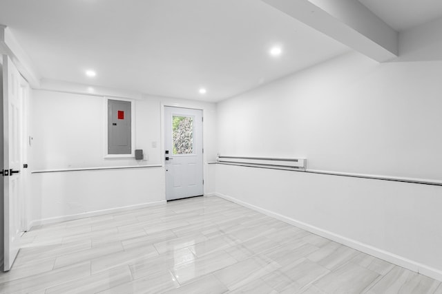 184 Overlook Dr, East Islip, NY 11730 - spare room with electric panel, a baseboard radiator, and recessed lighting