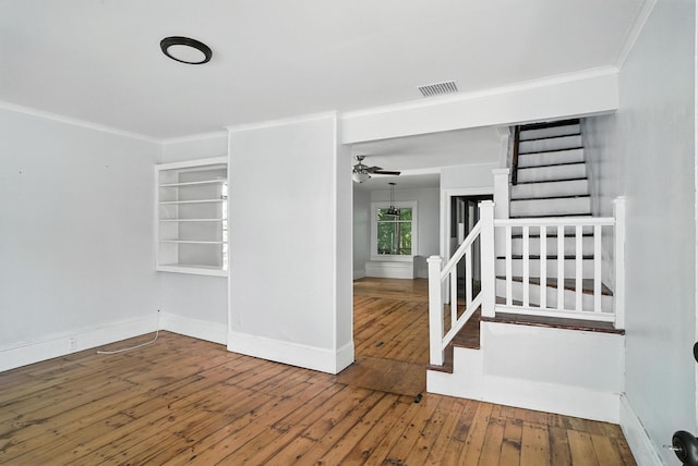 14 Washington Ave, Port Jervis, NY 12771 - empty room featuring stairs, hardwood / wood-style floors, crown molding, and ceiling fan