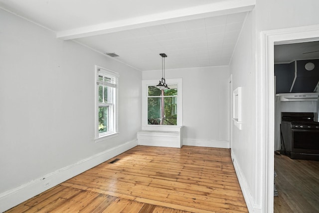 14 Washington Ave, Port Jervis, NY 12771 - unfurnished dining area with light wood-style floors and beam ceiling