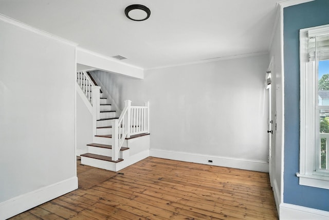 14 Washington Ave, Port Jervis, NY 12771 - entryway featuring ornamental molding, stairway, and hardwood / wood-style floors