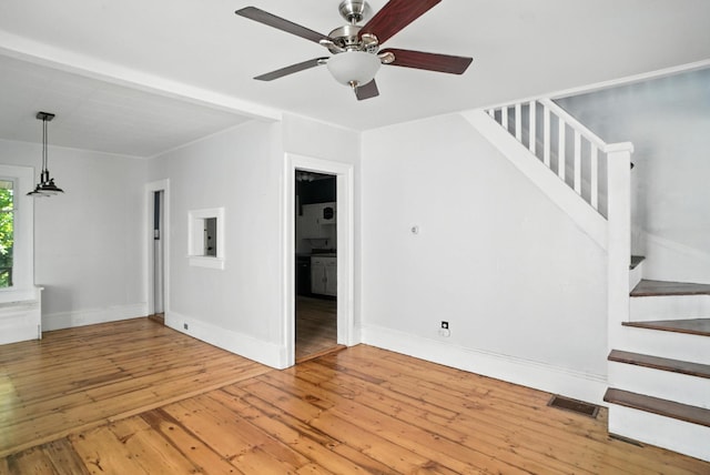 14 Washington Ave, Port Jervis, NY 12771 - unfurnished living room with wood-type flooring, stairs, and a ceiling fan