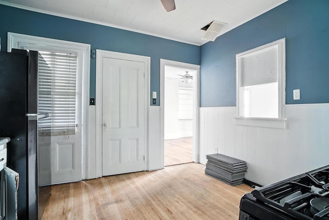 14 Washington Ave, Port Jervis, NY 12771 - entryway featuring a ceiling fan, a wainscoted wall, light wood-style flooring, healthy amount of natural light, and crown molding