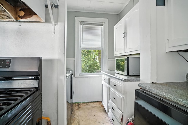 14 Washington Ave, Port Jervis, NY 12771 - kitchen with black stove, stainless steel microwave, white cabinetry, and unfinished concrete floors