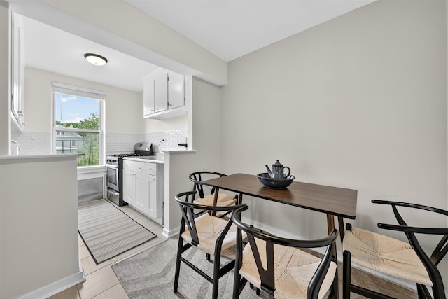 4295 Webster Ave Unit 5J, Bronx, NY 10470 - dining space with light tile patterned floors and baseboards
